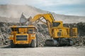 Komatsu PC4000 electric excavator loads ore mass into BelAZ dump truck. The action takes