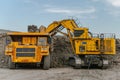 Komatsu PC4000 electric excavator loads ore mass into BelAZ dump truck. The action takes
