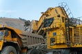 Komatsu PC4000 electric excavator loads ore mass into BelAZ dump truck. The action takes