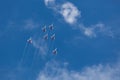 Russian aerobatic team Swifts at air show. Blue sky in the background