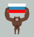 Russian aggressive bear. Angry animal holds Russian flag. Ferocious wild beast. Forest monster with big teeth and claws