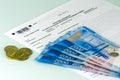 Russian annual tax Declaration of taxes of individuals. The Form 3-NDFL. A few Russian notes and coins are on the sheet of the Dec Royalty Free Stock Photo