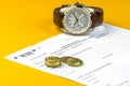 Russian annual tax Declaration of taxes of individuals. The Form 3-NDFL . A few Russian coins and watch are on the sheet of the De Royalty Free Stock Photo