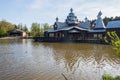 Russian architecture building on a lake with an aviation hangar