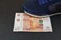 Russian banknotes under shoes