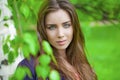 Russian beauty - Young brunette girl at a white birch Royalty Free Stock Photo