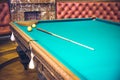 Russian billiard table with balls and cue sticks on a green background Royalty Free Stock Photo