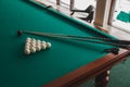 Russian billiard table with balls and cue sticks. Royalty Free Stock Photo