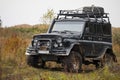 Russian black off road car UAZ in a meadow Royalty Free Stock Photo