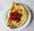 Russian blini with lingonberries Royalty Free Stock Photo
