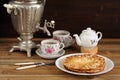 Russian bliny with vintage samovar and teaware Royalty Free Stock Photo