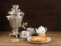 Russian bliny with vintage samovar and teaware