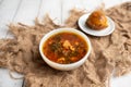 Russian borscht with sorrel and fresh garlic knots pamopushkas. Royalty Free Stock Photo