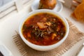 Russian borscht with sorrel and fresh garlic knots pamopushkas. Royalty Free Stock Photo