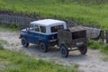 Russian car - UAZ HUNTER blue white with off-road trailer.  View from above. Royalty Free Stock Photo