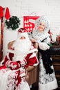 Russian Christmas characters: Ded Moroz Santa and Snegurochka snow girl. Royalty Free Stock Photo