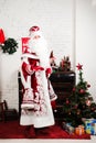Russian Christmas characters: Ded Moroz, Santa and Snegurochka, snow girl posing in the studio Royalty Free Stock Photo