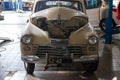 Russian classic vintage car part of the history in a repair shop in good condition in a disassembled condition with the engine and