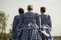 Russian clothing in folklore. Woman in traditional dress. A woman aged taken from the back.