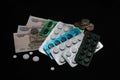Russian coins, banknotes and pills on black background Royalty Free Stock Photo