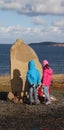 Russian Convoy Memorial with two kids reading inscription