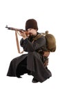 Russian Cossack points a rifle.