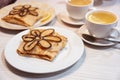 Russian crepes decorated with baked flower and tea Royalty Free Stock Photo