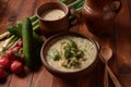 Russian cuisine- Okroshka, Summer light cold yogurt soup with cucumber, radish, eggs and dill with sour cream Royalty Free Stock Photo