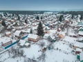 Russian dacha village near the lake and forest in winter, aerial view Royalty Free Stock Photo