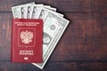 A passport with american dollar banknotes inside as work and travelling concept Royalty Free Stock Photo