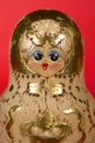 RUSSIAN DOLL ON RED BACKGROUND Royalty Free Stock Photo