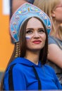 Russian fan girl wearing traditional Russian headdress kokoshnik