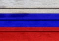 Russian Federation flag on a wood