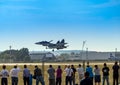 Russian fighter aircraft and spectators in the stands Royalty Free Stock Photo