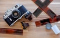 Russian Film Camera Zorki 4K with Kodak film and Lomography film and film sheet on wooden background Royalty Free Stock Photo