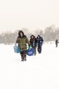 Russian Fishermen Ice Fishing in Winter Royalty Free Stock Photo