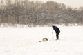 Russian Fishermen Ice Fishing in Winter Royalty Free Stock Photo