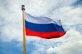 Russian flag close-up against a cloudy sky background Royalty Free Stock Photo