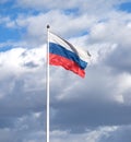 Russian flag on the flagpole waving on cloudy sky Royalty Free Stock Photo