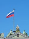 The Russian flag, flutters over the Winter Palace. St. Petersburg