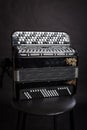 Russian folk musical instruments.Black Accordion isolated on a dark background