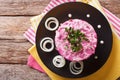 Russian food: holiday herring salad with vegetables closeup. horizontal top view Royalty Free Stock Photo