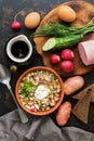 Russian food okroshka on a dark background, top view. Cold summer soup. Royalty Free Stock Photo