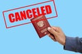 Russian foreign passport in the hands of a man. Prohibition of Schengen visas for Russian tourists to travel to the Royalty Free Stock Photo