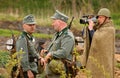 Russian and German soldiers. the reconstruction of the battle in military uniform of world war II.