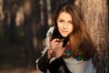 Russian girl in headscarves near the tree in the forest Royalty Free Stock Photo