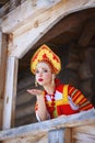 Russian girl in a kokoshnik sends an air kiss Royalty Free Stock Photo