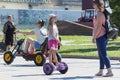 The Russian girl rides a giroskuter in the summer on the square. Royalty Free Stock Photo