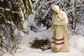 Russian girl with a sled in the winter woods Royalty Free Stock Photo