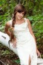 Russian girl in white dress in a birch forest Royalty Free Stock Photo